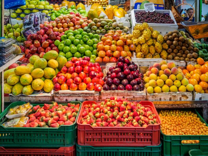 Photo by Alexander Schimmeck red and green apples on red plastic crate