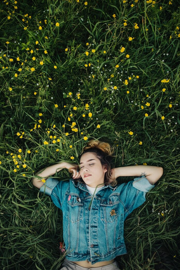 Photo by Wes Hicks woman lying on grassland