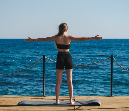 여름철 건강관리, 기본 수칙만 잘 지켜도 건강하게 보낼 수 있다 a person doing yoga on a dock