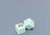 “집에서도 손쉽게…AI와 함께하는 스마트 건강 관리” Two dice with ai letters and dots